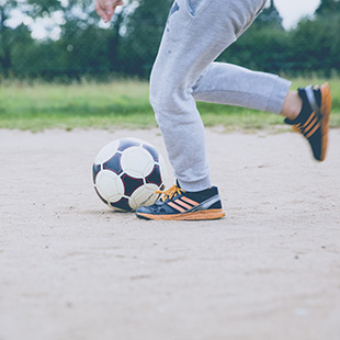 teen playing soccer