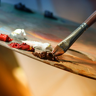 the art of regret blog post, paint brush dipped in brown paint