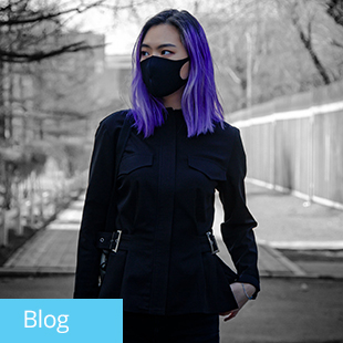 img text: Blog img des: Person wearing mask, standing outside